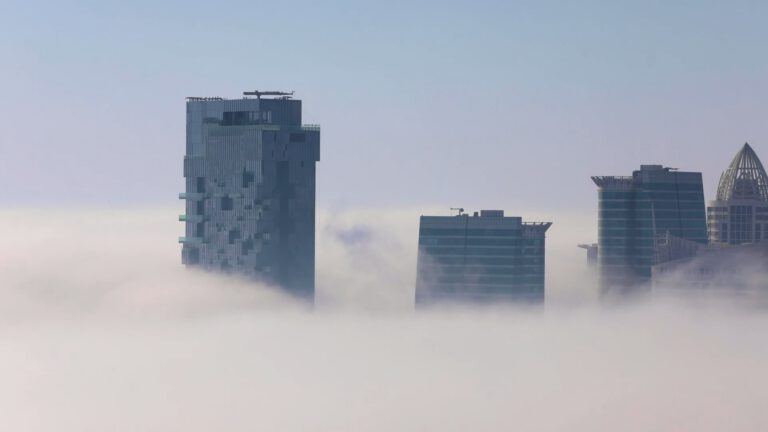 Skyscrapers peaking out of the clouds